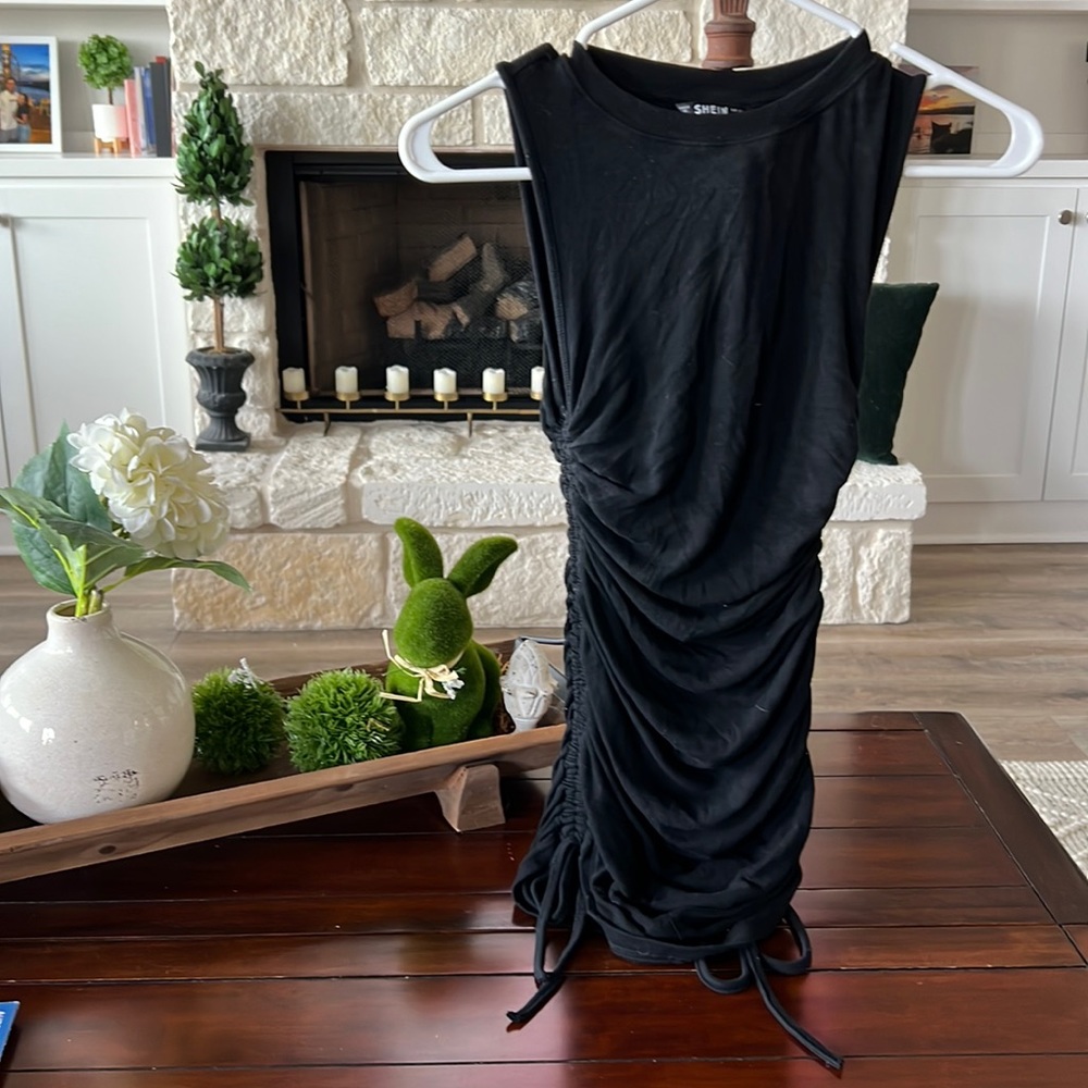 Size XS MINI DRESS ribbed material with ties on side to adjust. New no tag